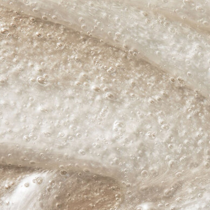 Close-up of the translucent, pearly gel texture with air bubbles in Loved 01 Deep Moisturizing Exfoliating Cleanser (2 Pack, 6oz), infused with nourishing Sea Buckthorn Oil.