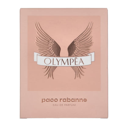 A pink box displays the Paco Rabanne Olympea Eau De Parfum For Women 1.7oz logo with bronze wings and Olympea text, capturing the iconic amber floral scent from Paco Rabanne.