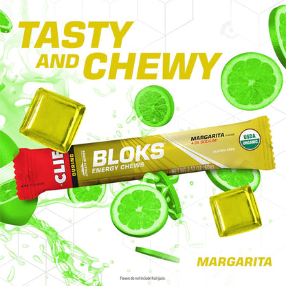 CLIF BLOKS Energy Chews Margarita Flavor with 3X Sodium by Clif—surrounded by lime slices and yellow chews. Perfect for quick energy and fast fuel on the go. Pack contains 2.12oz, 18 count. Tasty and Chewy and Margarita in bold letters on pack.