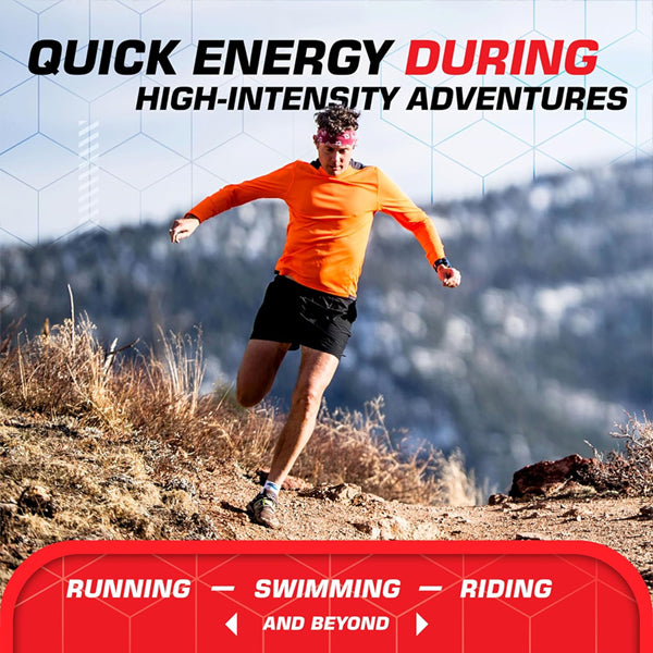 A man in an orange shirt and black shorts runs on a mountain trail. Try Clif BLOKS Energy Chews Margarita Flavor with 3X Sodium—quick energy for high-intensity activities like running, swimming, and riding. Box includes 18 packs (2.12oz each).