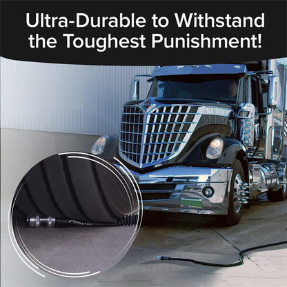 A large semi-truck drives over the Pocket Hose Silver Bullet 50 ft by Pocket Hose on pavement, demonstrating the garden hoses impressive durability and toughness.